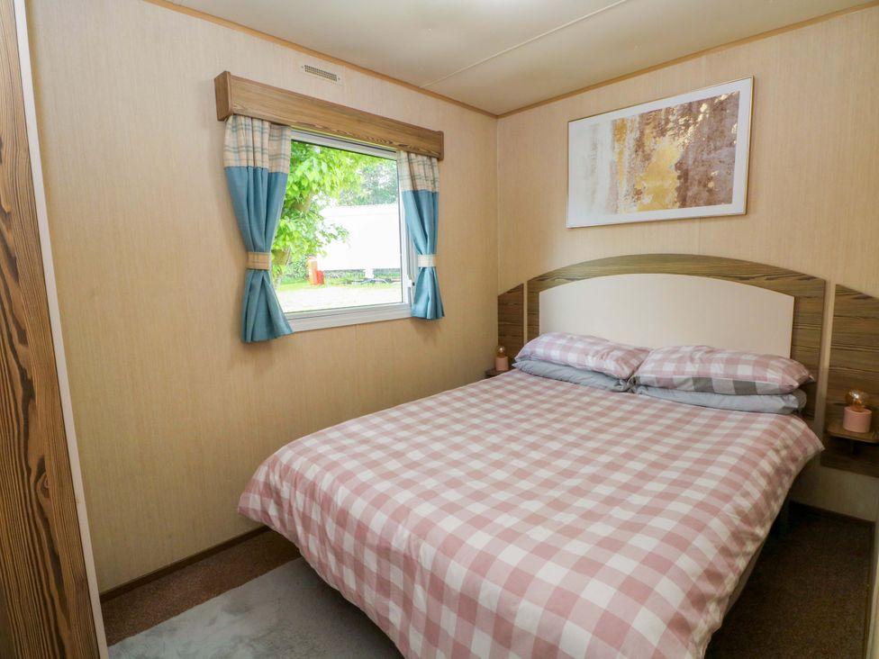 A bedroom with a bed and window at Kensington 49