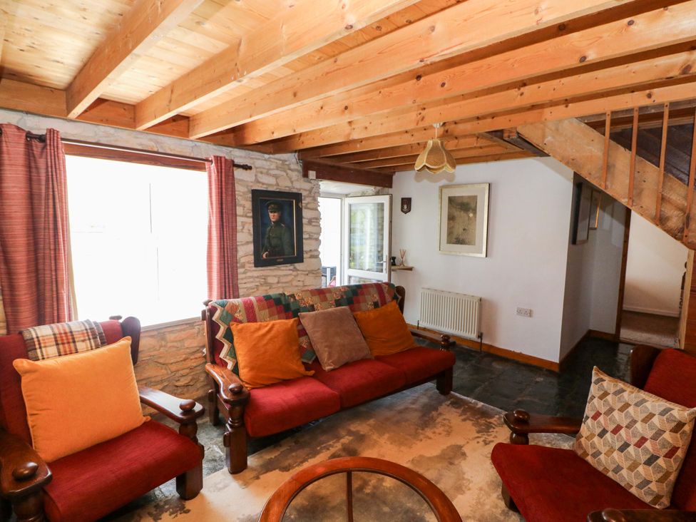 A living room with a sofa and armchairs at Tach Ferme in 