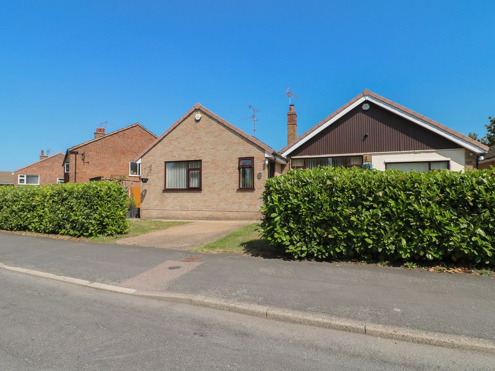 A house with hedges and pathway at 27a Wolds Drive Nottingham