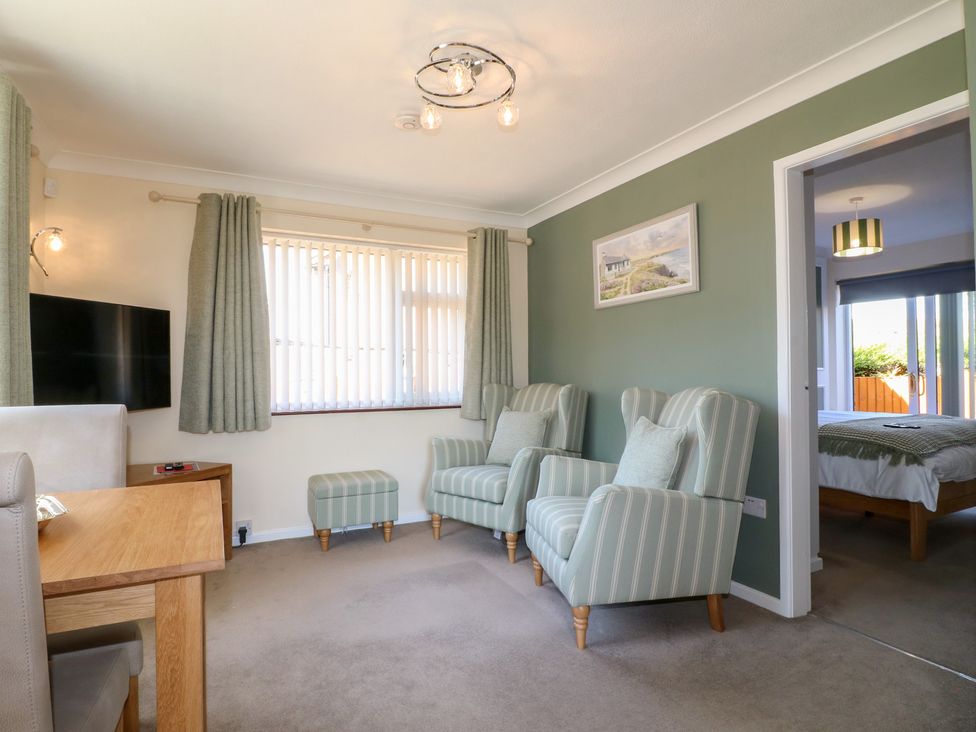 A living room with a sofa and armchairs at 27a Wolds Drive Nottingham