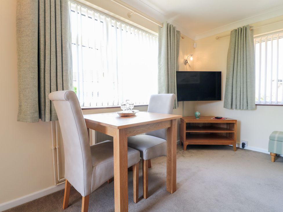 A dining area with a table and chairs at 27a Wolds Drive Nottingham