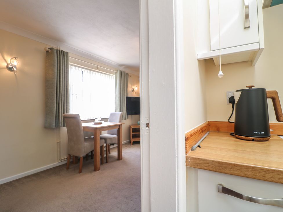 A dining area with a table and chairs at 27a Wolds Drive Nottingham