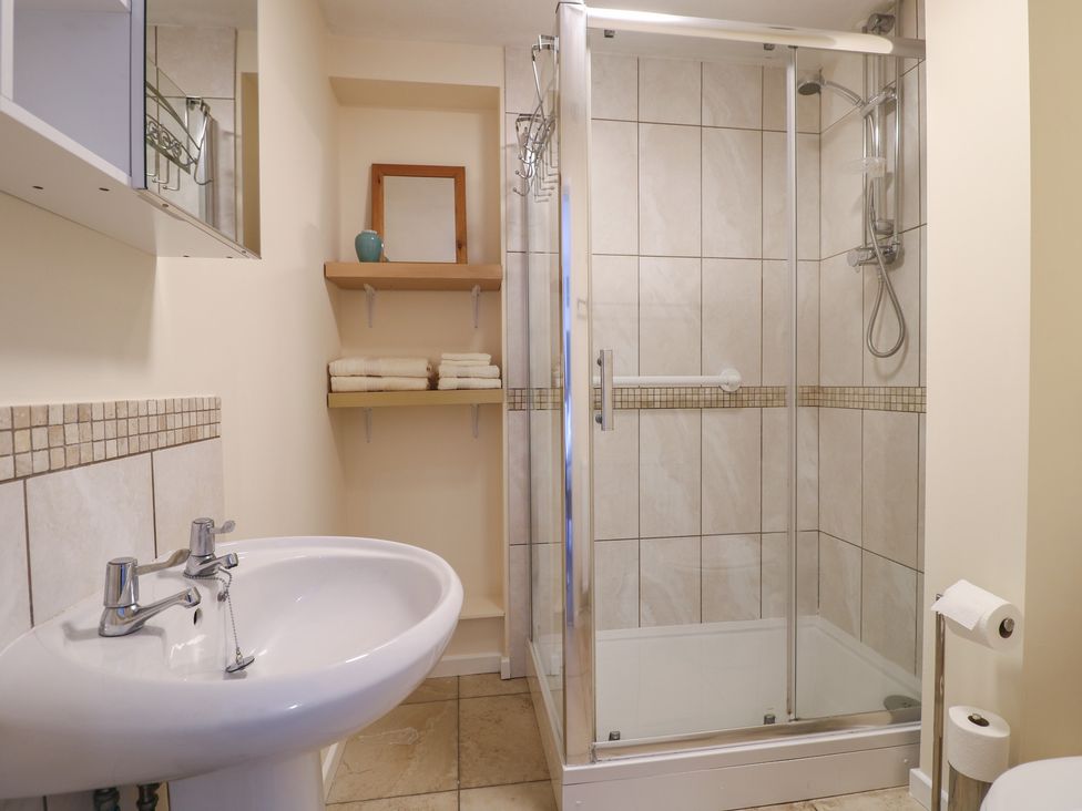A bathroom with a sink and shower at 27a Wolds Drive in Nottingham