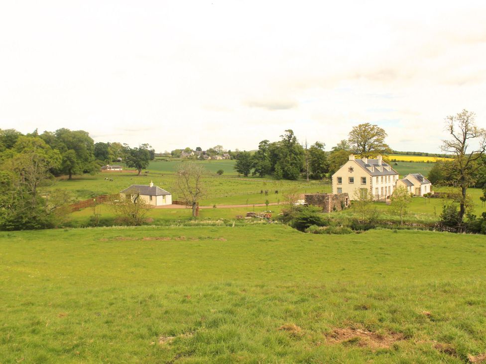 A view of a cottage surrounded by fields and trees at Country Cottage Sleeps 3 with Garden and Parking