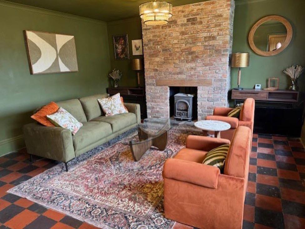 A living room with a sofa and armchairs at Llysawelon 2-Bed Cottage, Sleeps 5, Pets Ok, Llysawelon near Llansteffan