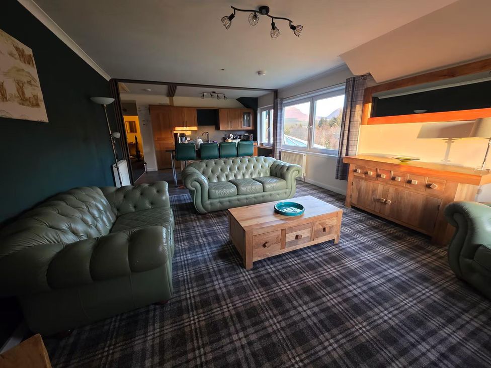 A living room with sofas and a coffee table at Highlands - River View - Apt - Sleeps 4 - Garden, Garve near Strathpeffer