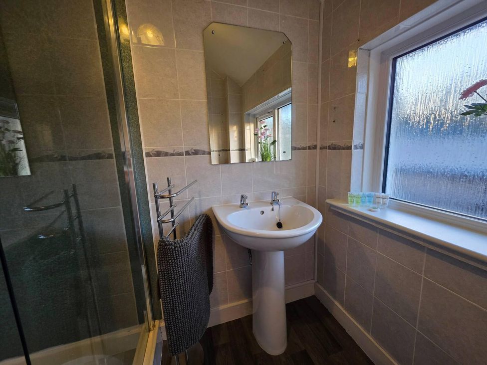 A bathroom with a sink and shower at Highlands - River View - Apt - Sleeps 4 - Garden Garve near Strathpeffer