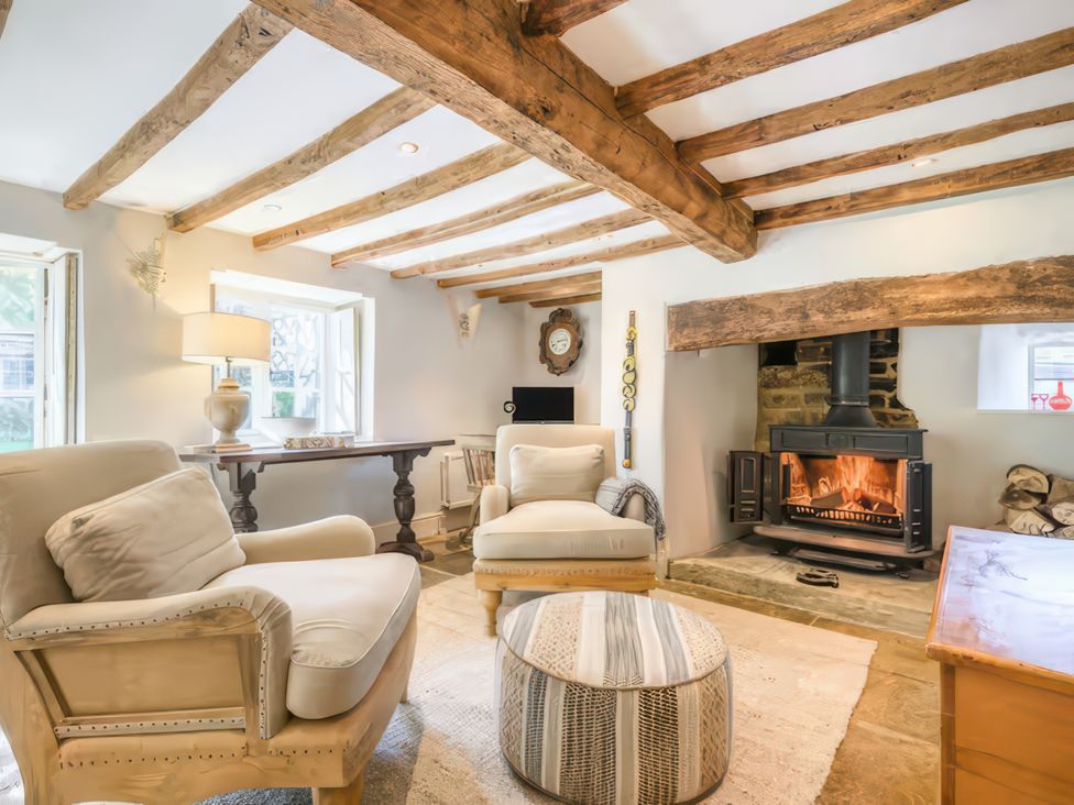 A living room with a fireplace and two sofas at Cotswolds - Garden - Bbq - Parking - Sleeps 6 near Shipston-On-Stour