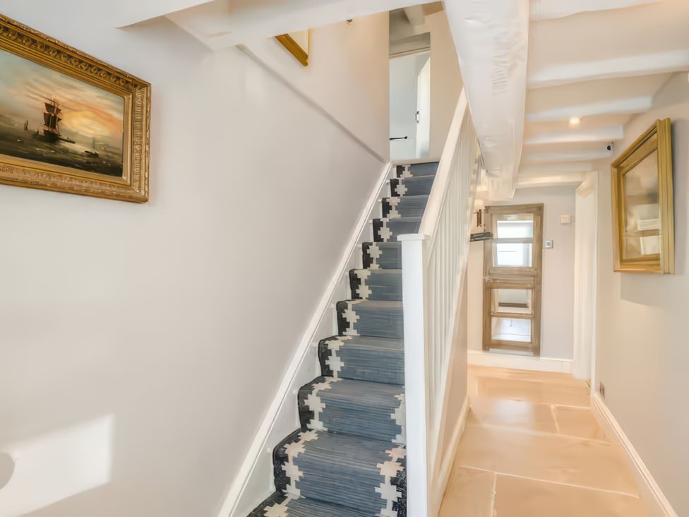 A hallway with a staircase and artwork at Cotswolds - Garden - Bbq - Parking - Sleeps 6 near Shipston-On-Stour