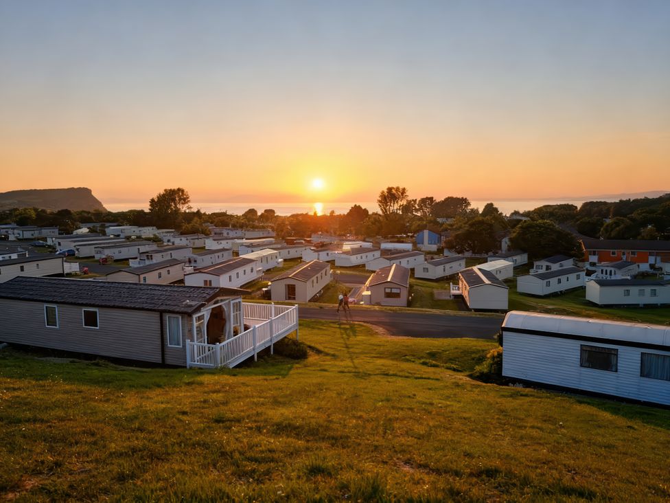 A view of caravans and sunset at Caravan Sleeps 6 with Sea Views and Parking in Ayr