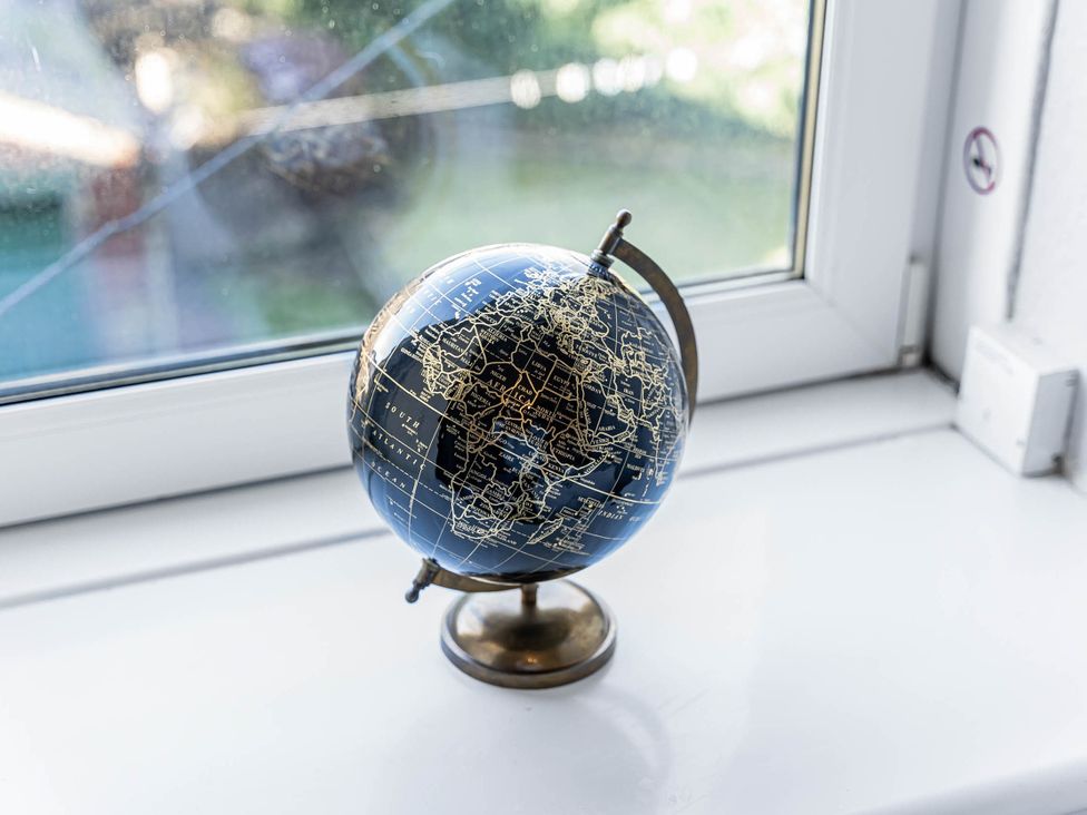 A globe on a windowsill at Central Aberdeen flat Holburn St workspace parking Aberdeen