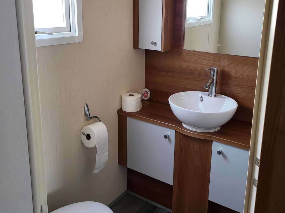 A bathroom with a sink and a toilet at BandR Turnberry Escape Scotland in Girvan