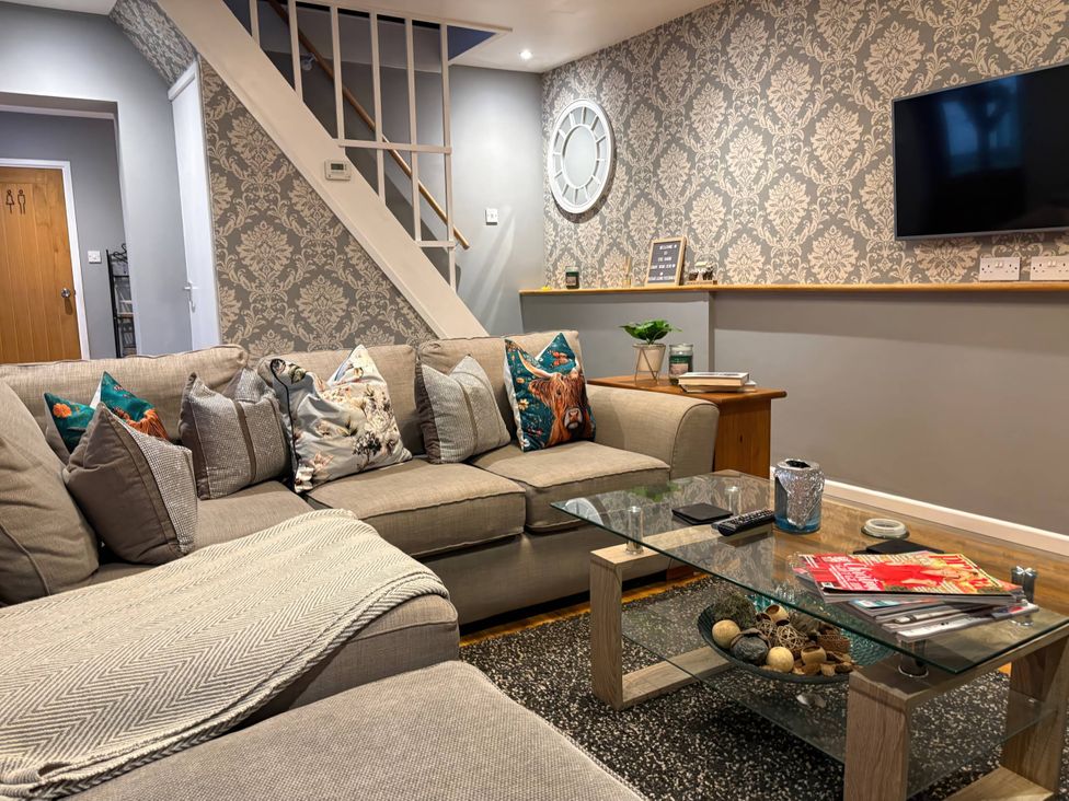 A living room with a sofa and a coffee table at Rural 2 double bedrooms Barn Mill Meece near Eccleshall