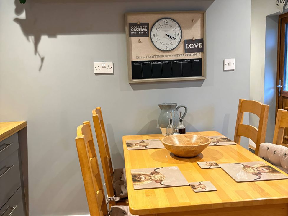A dining room with a table and chairs at Rural 2 double bedrooms Barn Mill Meece near Eccleshall