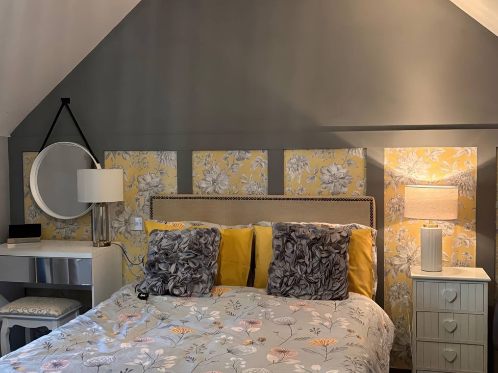 A bedroom with a bed and bedside table at Rural 2 double bedrooms Barn Mill Meece near Eccleshall