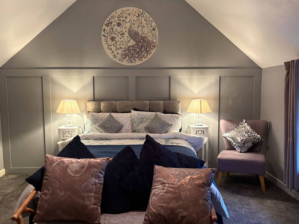 A bedroom with a bed and cushions at Rural 2 double bedrooms Barn Mill Meece near Eccleshall