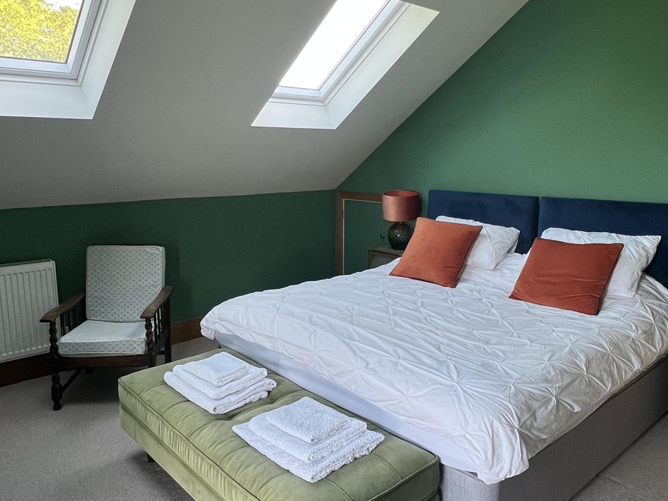 A bedroom with a bed and chair at 2 Guests Studio - Free Parking - Stunning Views near Bruton