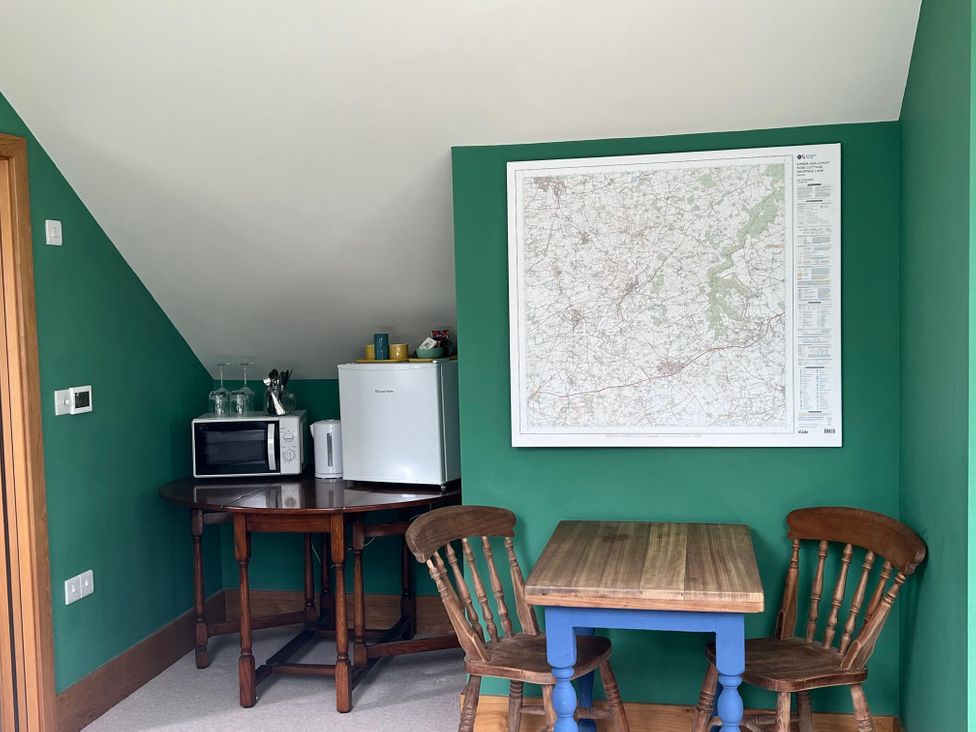 A kitchenette with a table and chairs at 2 Guests Studio - Free Parking - Stunning Views near Bruton