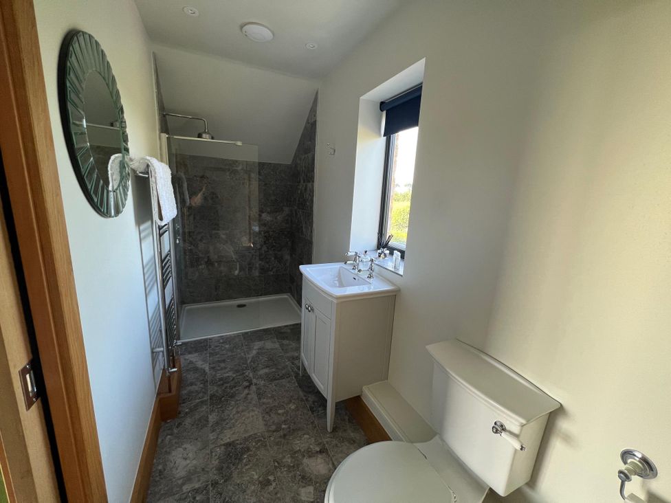 A bathroom with a shower and sink at 2 Guests Studio - Free Parking - Stunning Views near Bruton