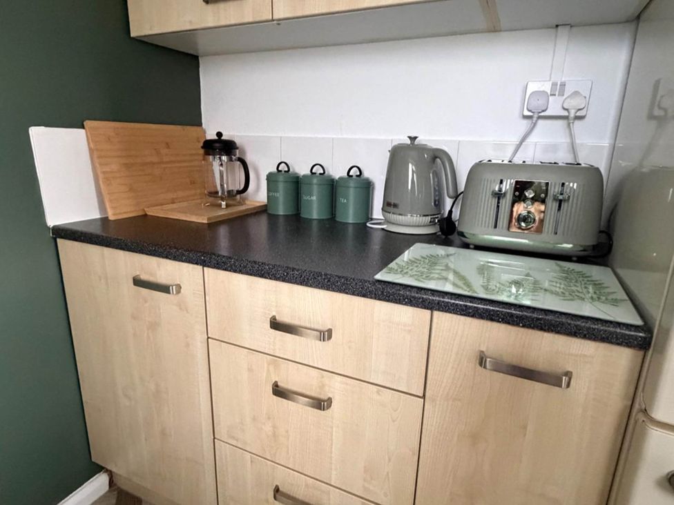 A kitchen with a kettle, toaster, and coffee press at Meriden Apartment - Sleeps 7 - Near Nec, Parking in Meriden