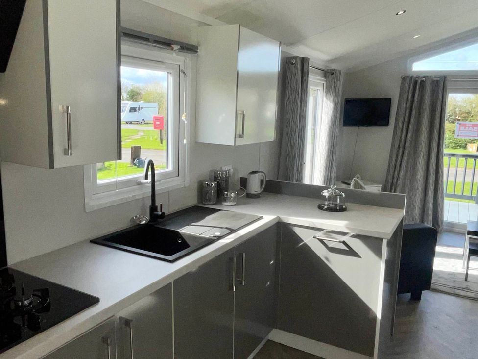 A kitchen with a sink and kettle at Chalet 4 guests Parking Available near Tuxford