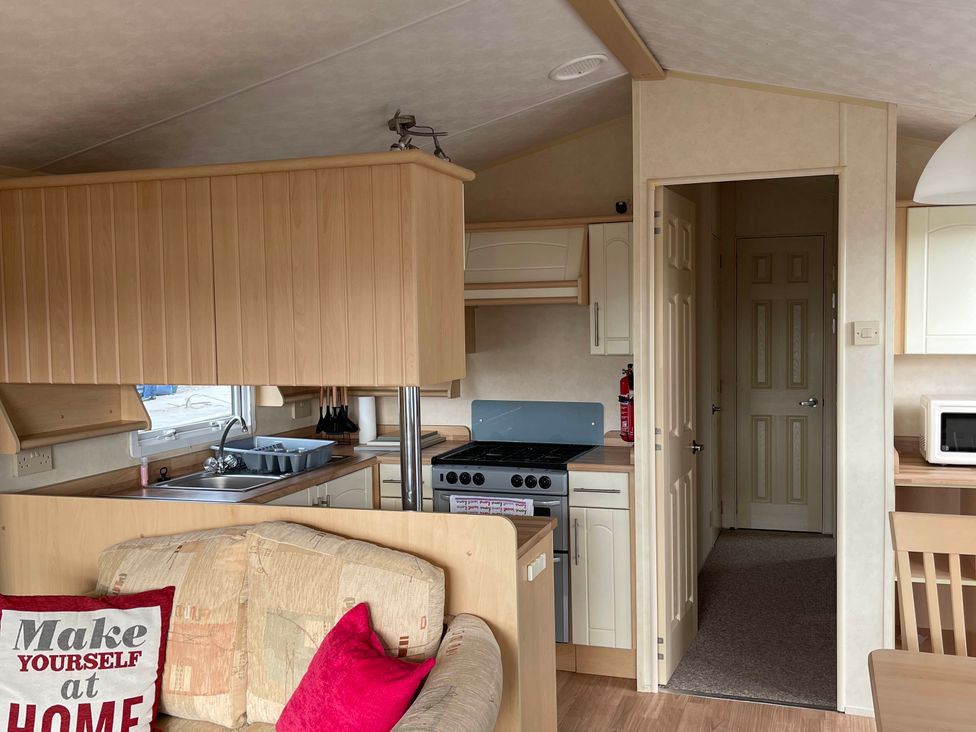 A kitchen with a stove and sink at Beautiful 2 Bed Static caravan