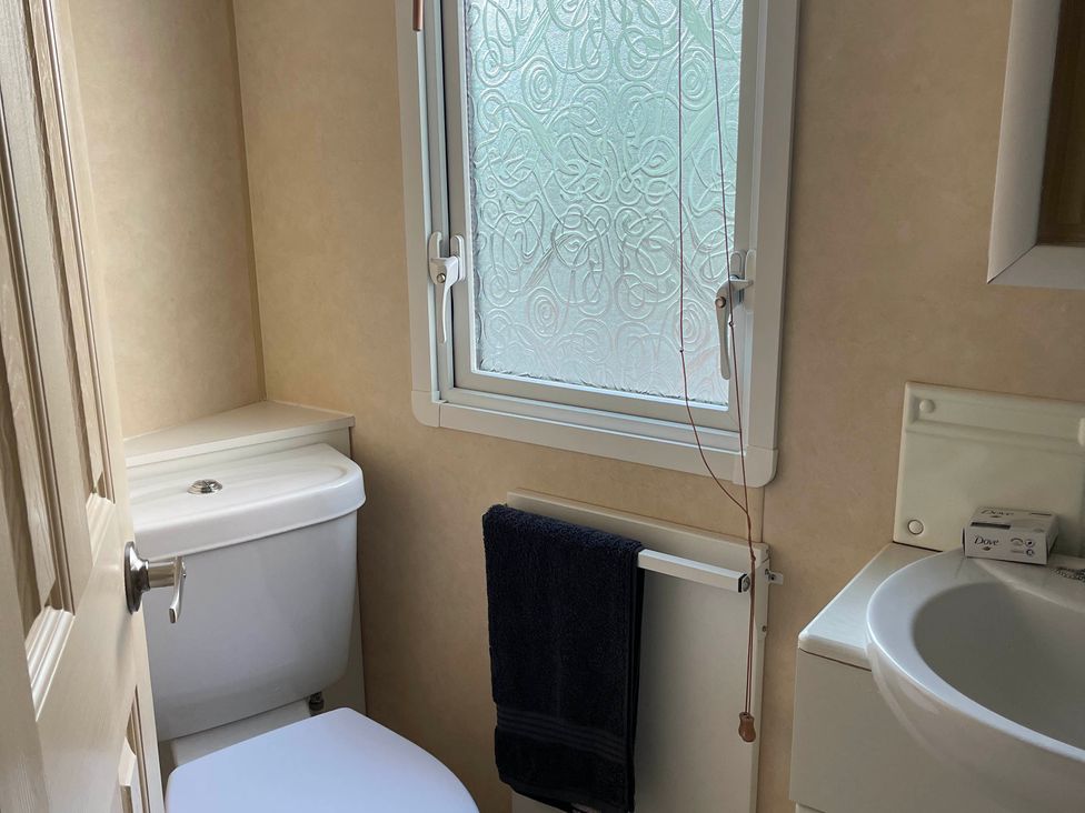 A bathroom with sink and toilet in Beautiful 2 Bed Static caravan 