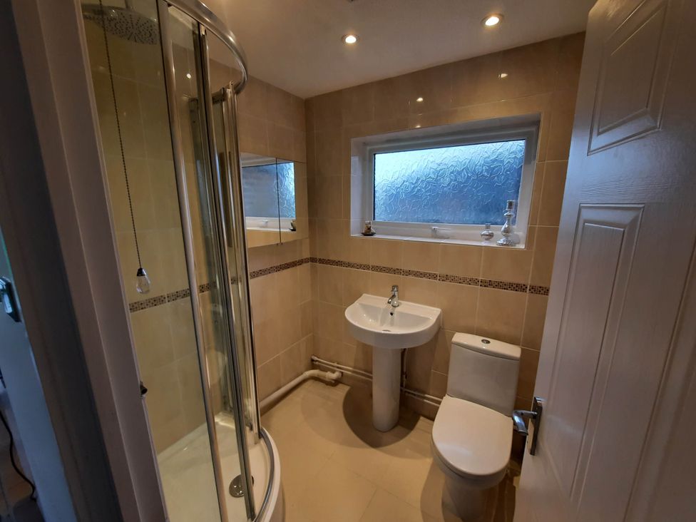 A bathroom with shower, sink, and toilet at St Margaret's 2 Bed Chalet Sleeps 4 Pets Ok
