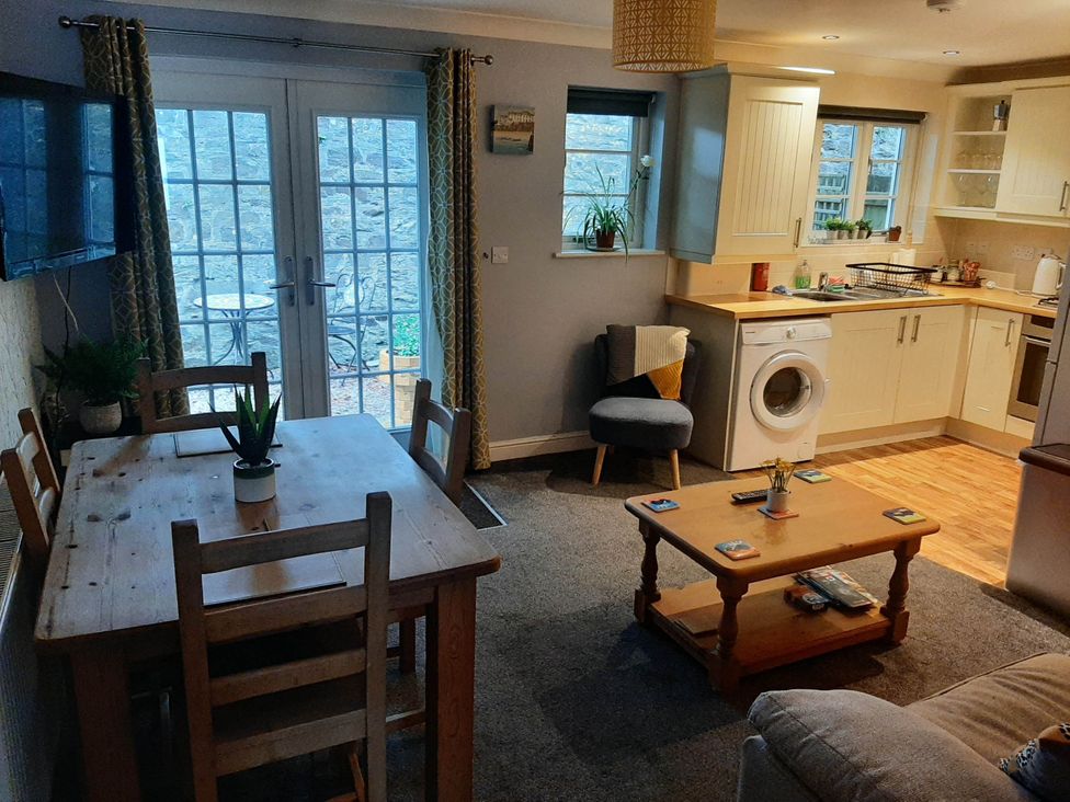 A living room with a dining table and chairs at Ground Floor Cornish Retreat Free Parking, Bodmin