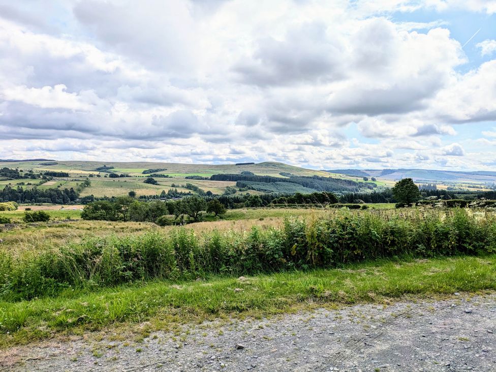 A landscape with hills and trees at Pet Friendly - Lodge at Riverview Holiday Park, Mangerton near Newcastleton