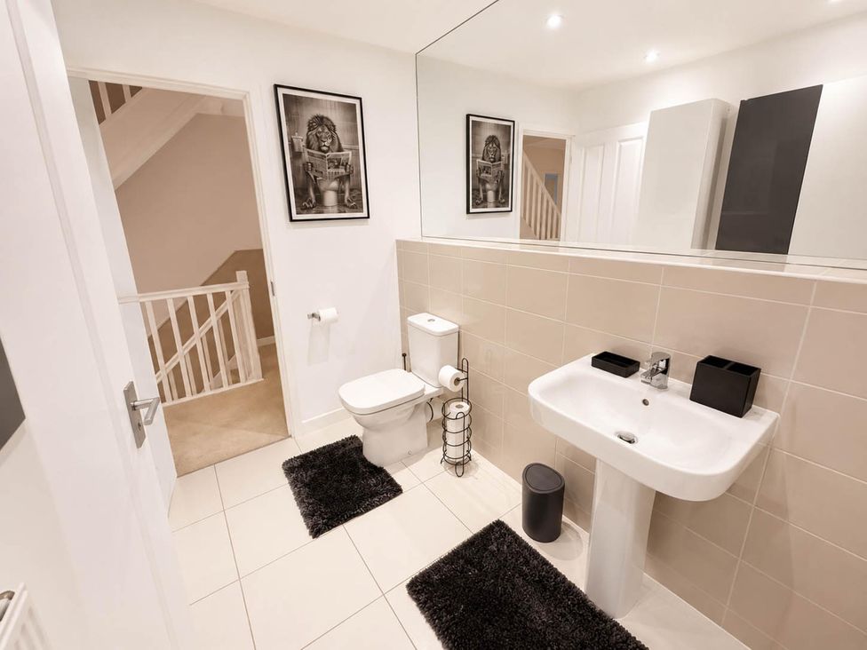 A bathroom with a sink and toilet at House Sleeps 12 with WiFi, Bristol