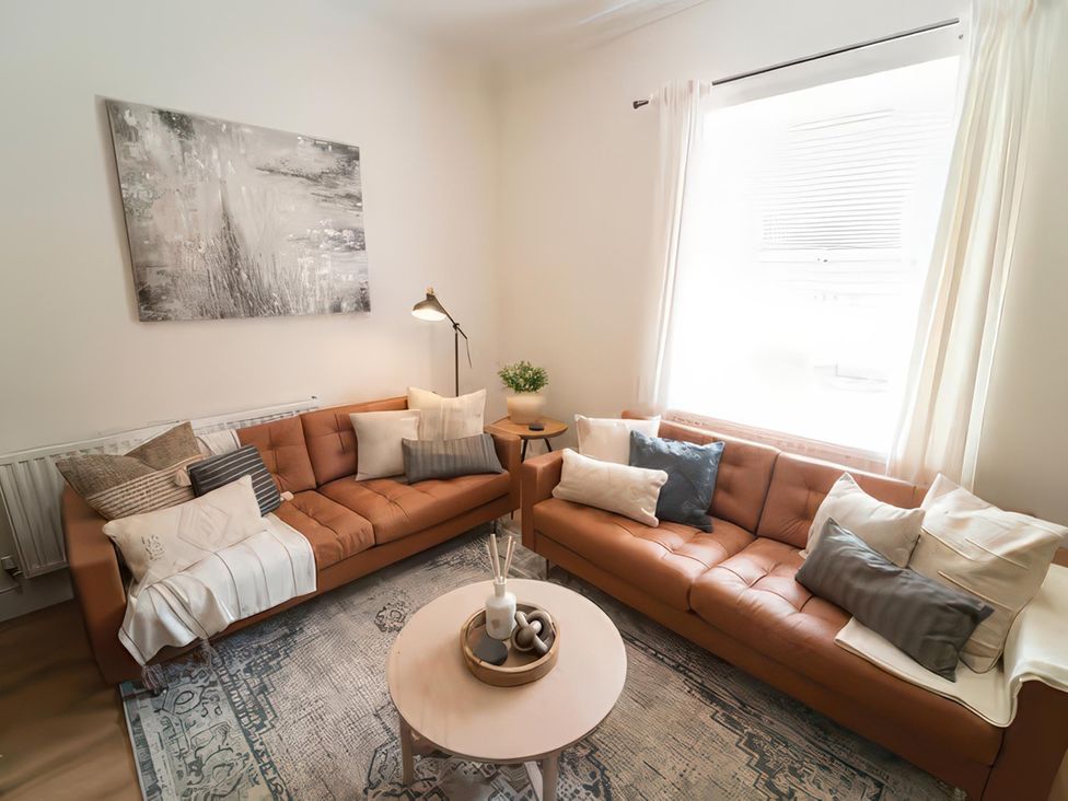 A living room with two sofas and a coffee table at Foundry Farm Apartment 