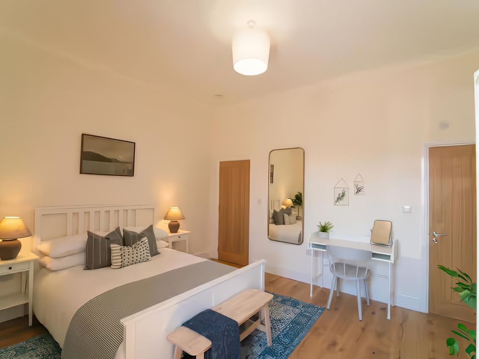 A bedroom with a bed and a desk at Foundry Farm Apartment in 