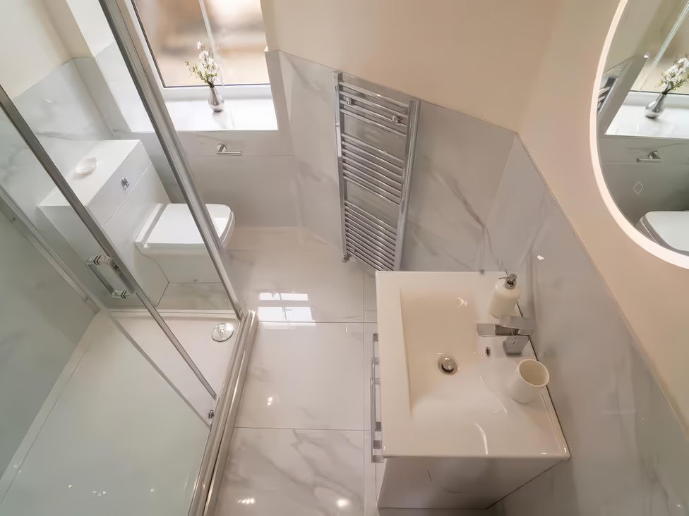 A bathroom with a sink and toilet at Foundry Farm Apartment