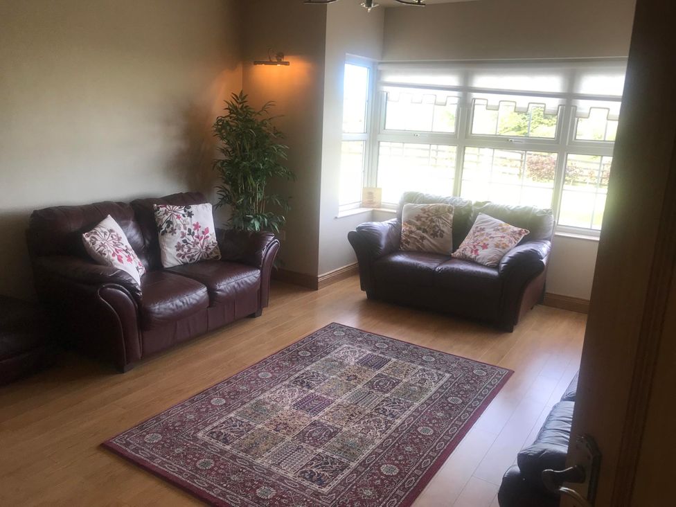 A living room with two sofas and a rug at Dungannon 2 Bed Bungalow - Sleeps 5 - Pet Friendly near Dungannon