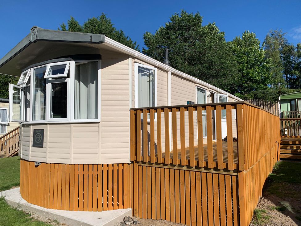 A static caravan with a wooden deck at Static Caravan 2 Bedrooms - sleeps 4 in Hawick