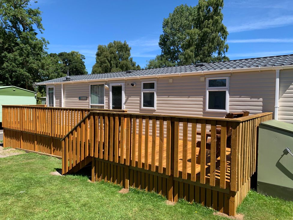A caravan with wooden decking and handrails at Static Caravan 2 Bedrooms - sleeps 4 Hawick