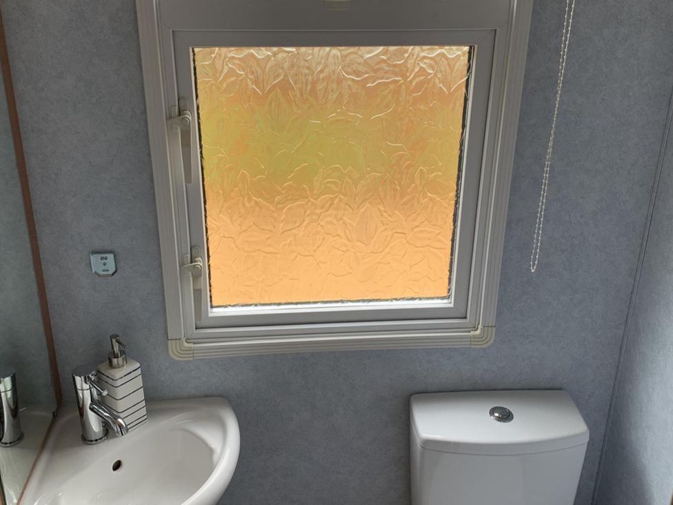 A bathroom with a sink and toilet at Static Caravan  2 Bedrooms  - sleeps 4, Hawick