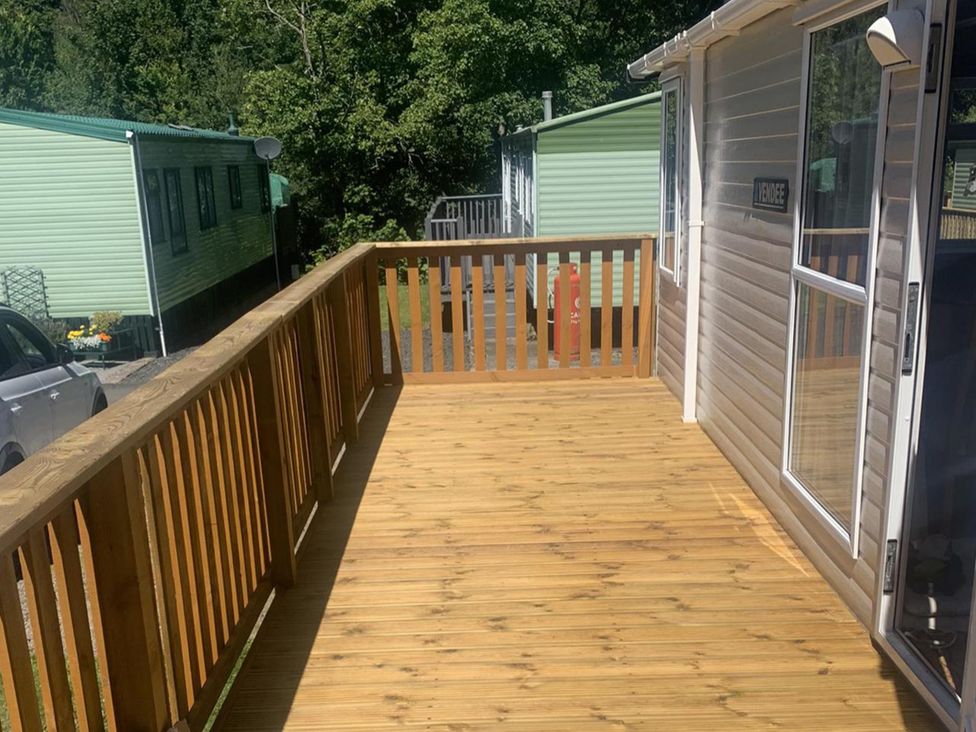A deck area with wooden flooring at Static Caravan 2 Bedrooms - sleeps 4 in Hawick