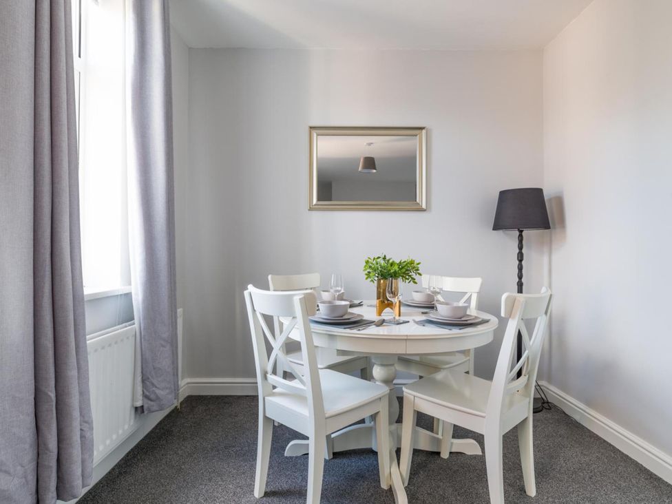 A dining room with a table and chairs at Lily Apartment - Sleeps 3 - Pet friendly - Parking in Bedlington