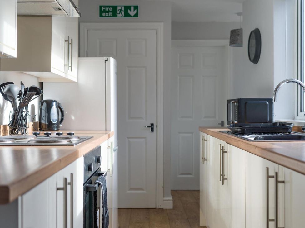 A kitchen with a stove, fridge, and microwave at Lily Apartment - Sleeps 3 - Pet friendly - Parking Bedlington