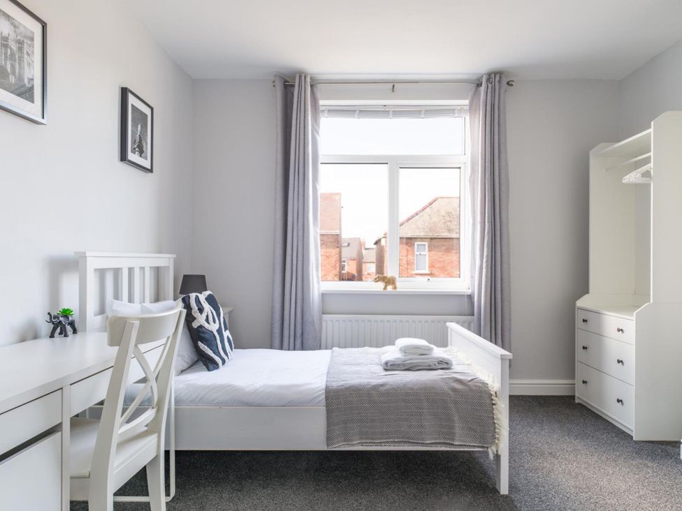 A bedroom with a bed and a desk at Lily Apartment - Sleeps 3 - Pet friendly - Parking in Bedlington