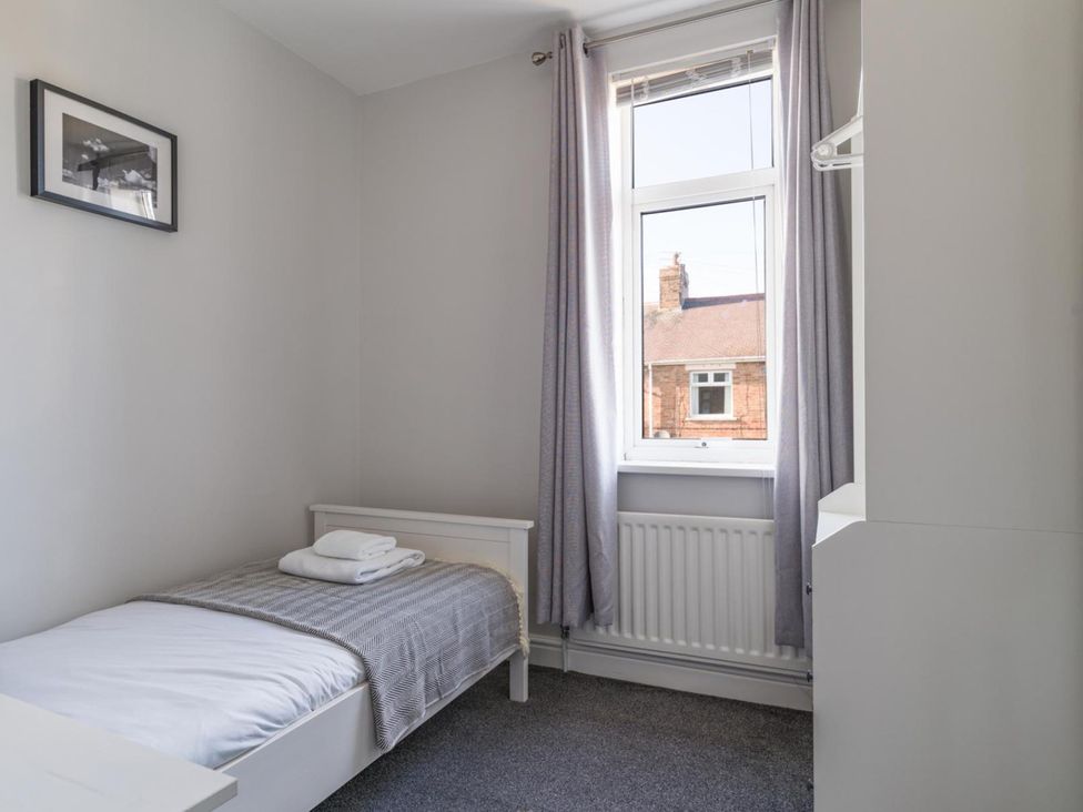 A bedroom with a bed and window at Lily Apartment - Sleeps 3 - Pet friendly - Parking in Bedlington