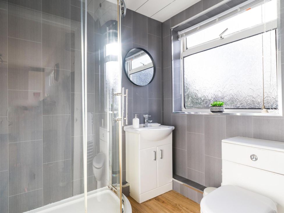 A bathroom with a shower, sink, and toilet at Lily Apartment - Sleeps 3 - Pet friendly - Parking, Bedlington
