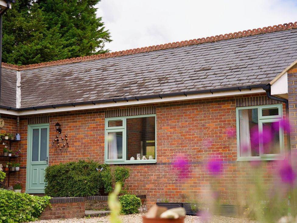 An exterior view of a house with windows and a door at TBC in 