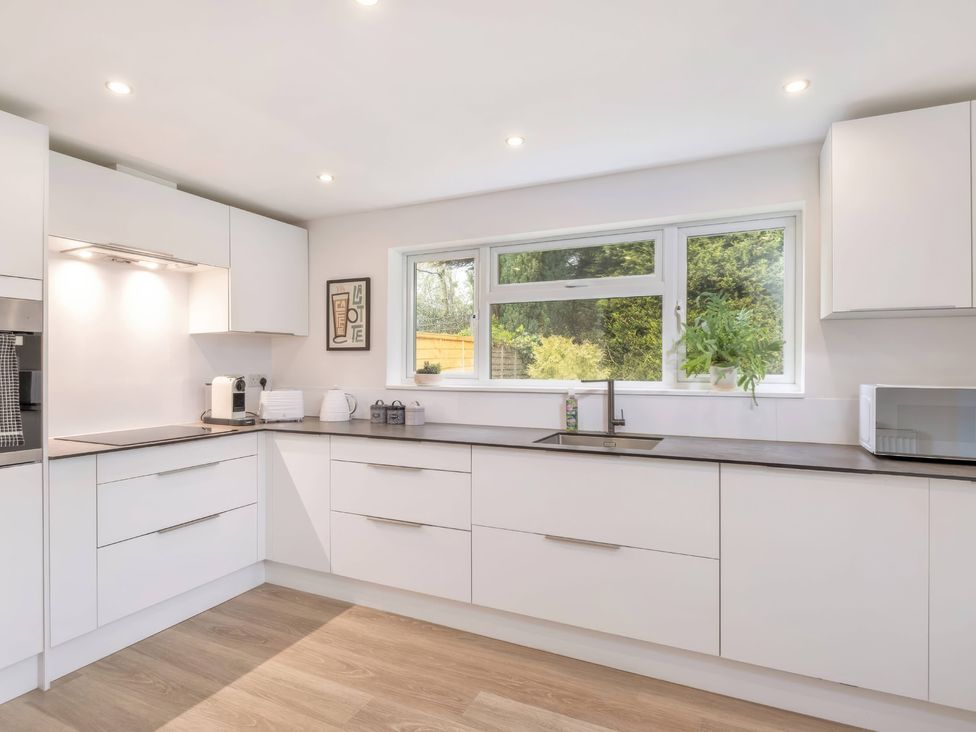 A kitchen with a sink and appliances at TBC 