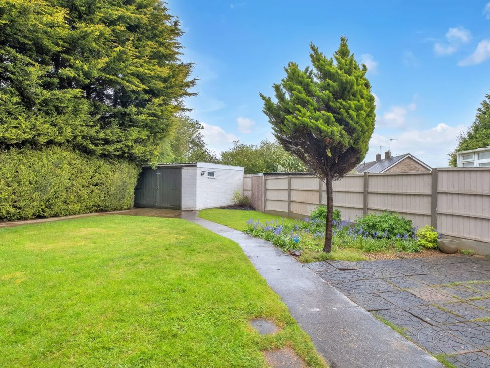 A garden with grass and a path at TBC 
