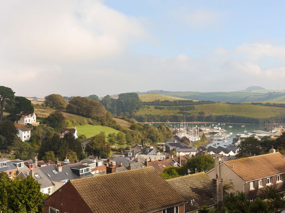 View of houses and boats near water at 6 Knowle Court in Salcombe