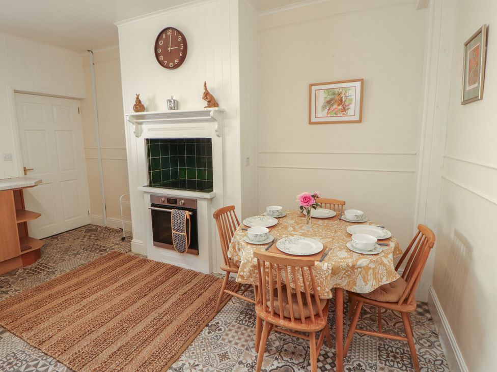 A dining room with a table and chairs at 30 George Street in Wigton