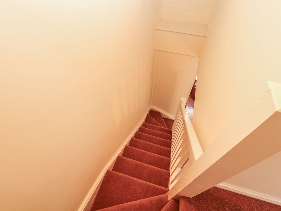 A staircase with a carpeted floor at 30 George Street Wigton